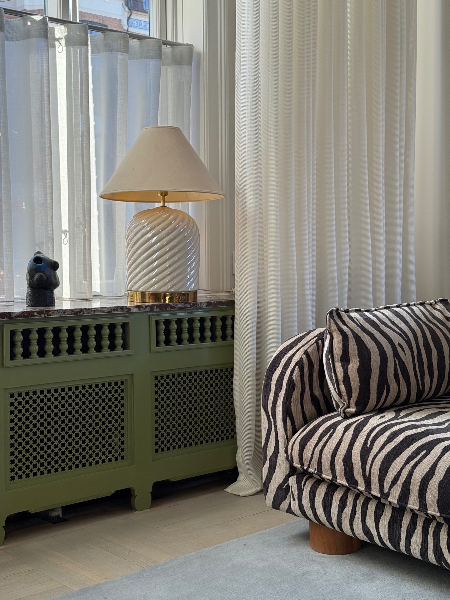 Vintage Italian ceramic table lamp with a linen shade in a Copenhagen showroom